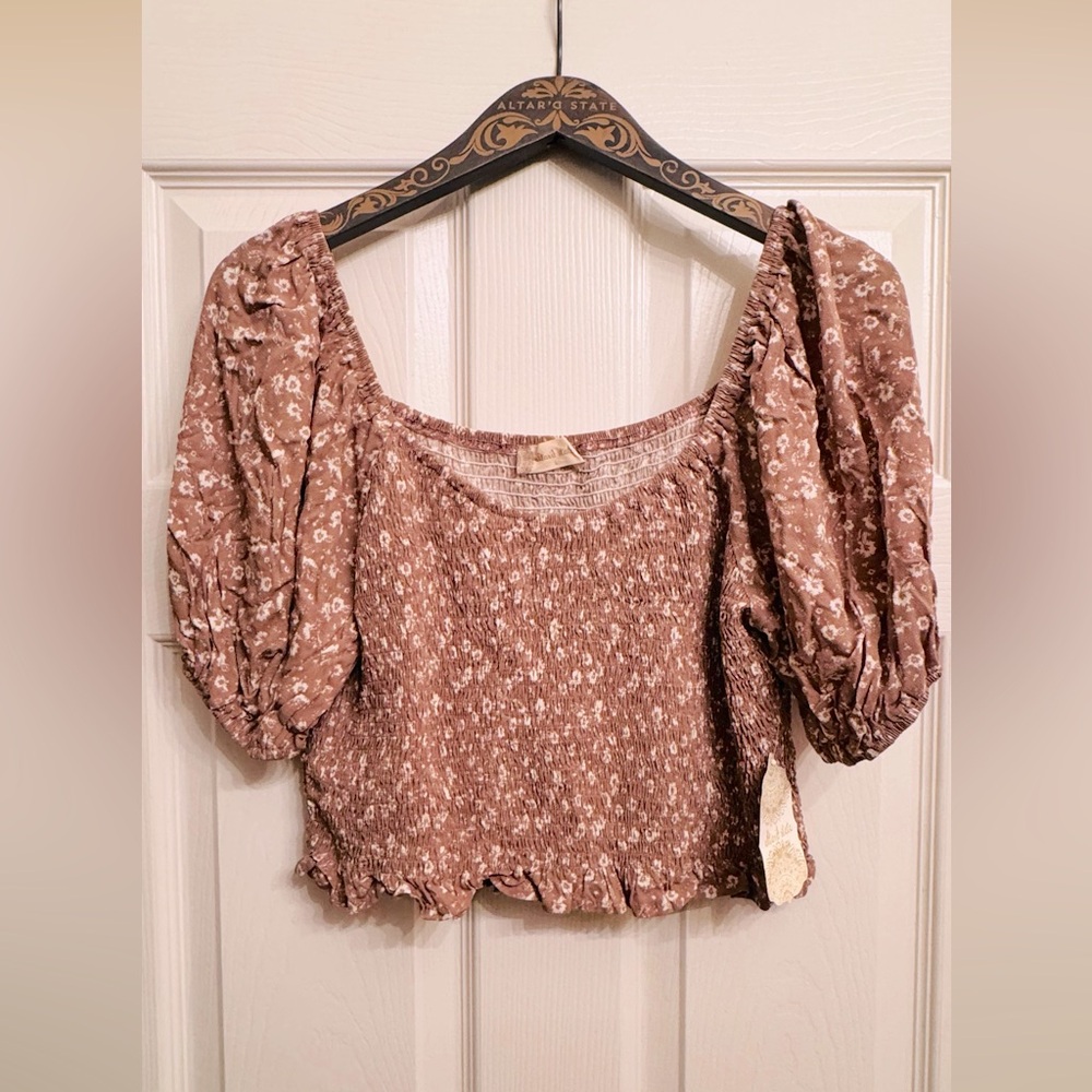 Altar’d State tan with cream floral crop top.